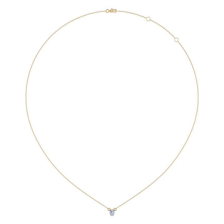 Oval Cut Tanzanite & Diamond Birthstone Necklace In 14K Yellow Gold